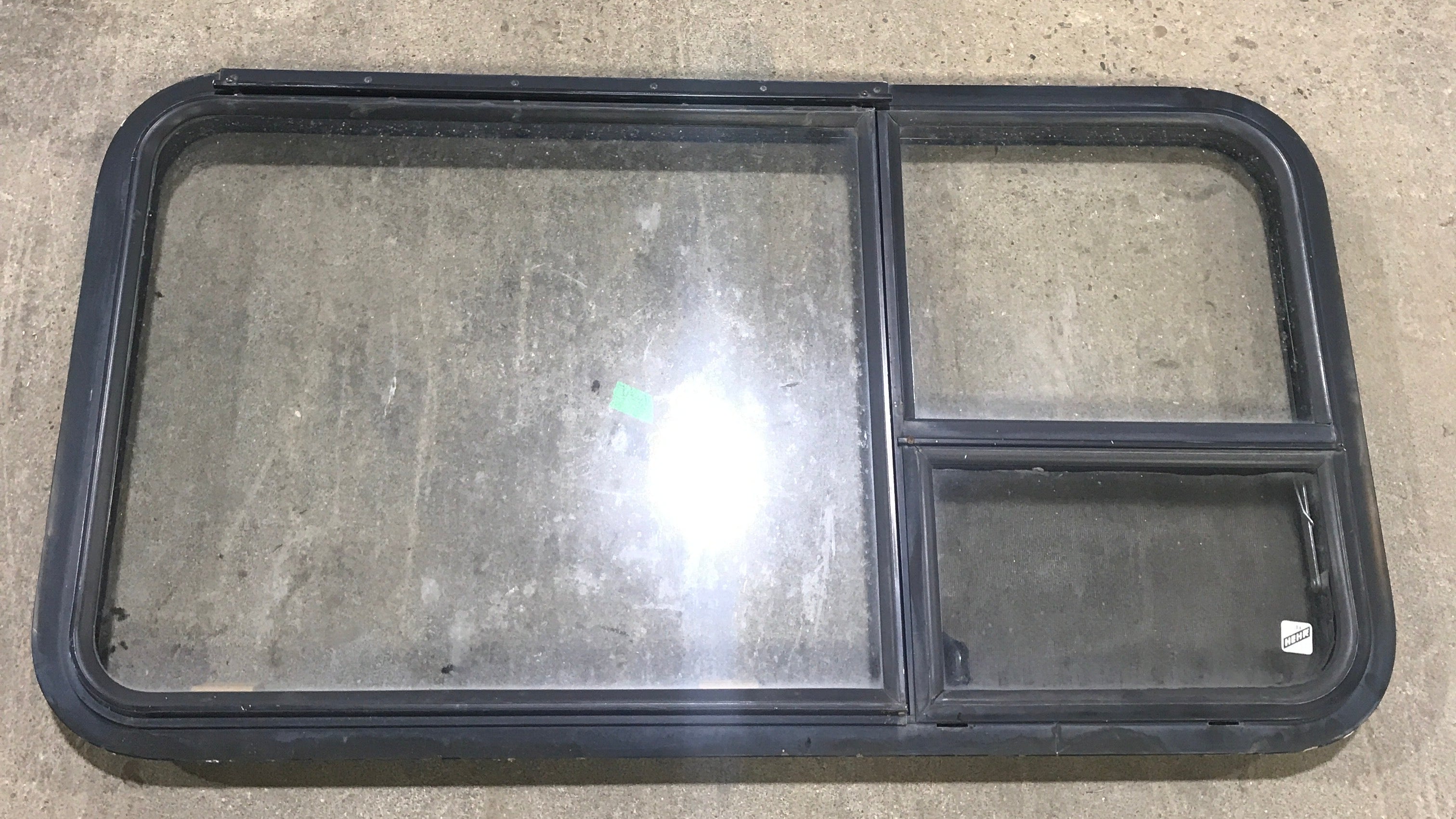 Used Black Radius Emergency Opening Window : 41 1/2" W X 21 1/2" H X 2" D - Young Farts RV Parts