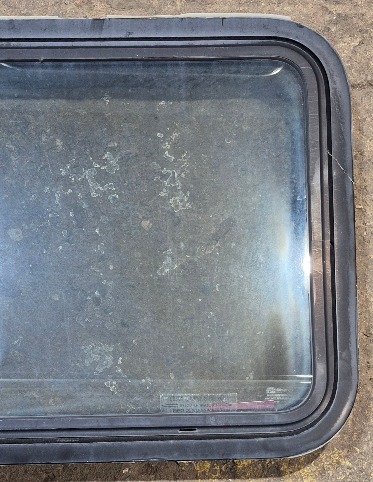 Used Black Radius Emergency Opening Window : 29 1/2" W x 21 1/2" H x 2" D - Young Farts RV Parts