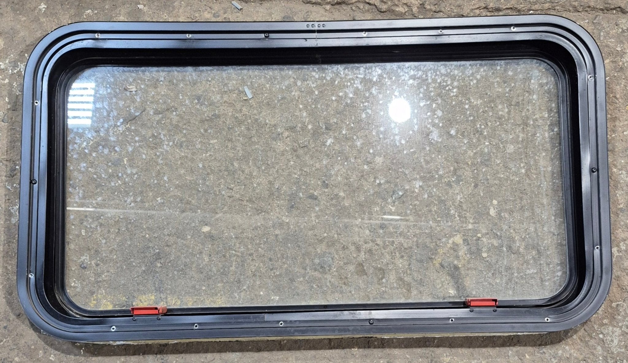 Used Black Radius Emergency Opening Window : 35 1/2" W x 18 1/2" H x 1 7/8" - Young Farts RV Parts