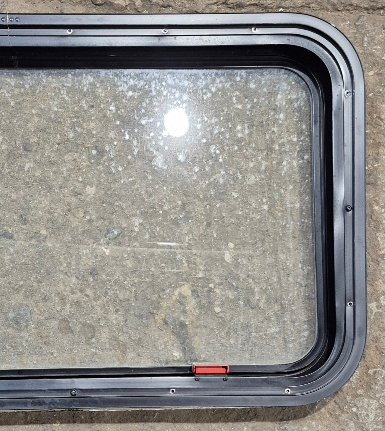 Used Black Radius Emergency Opening Window : 35 1/2" W x 18 1/2" H x 1 7/8" - Young Farts RV Parts