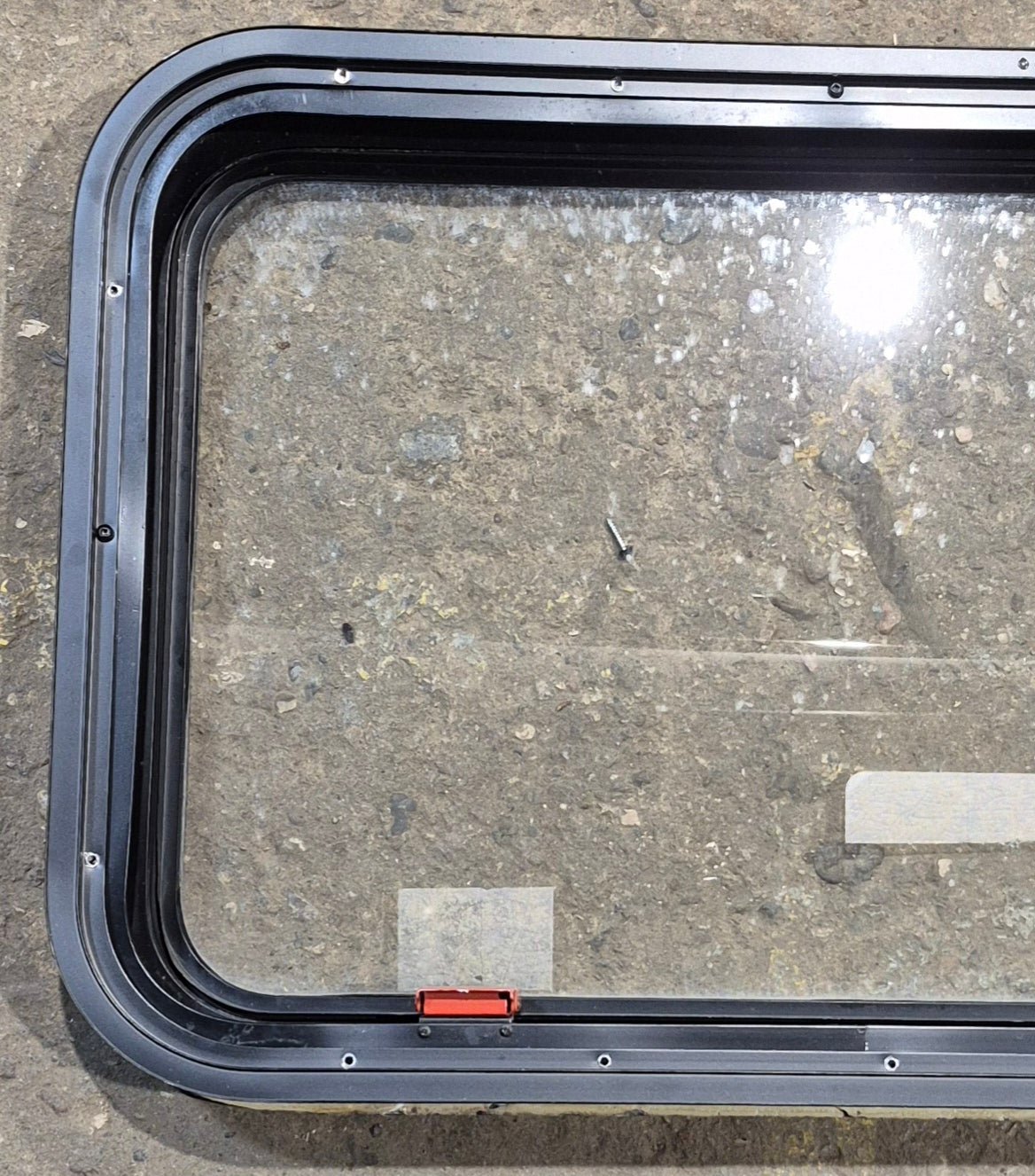 Used Black Radius Emergency Opening Window : 35 1/2" W x 18 1/2" H x 1 7/8" - Young Farts RV Parts