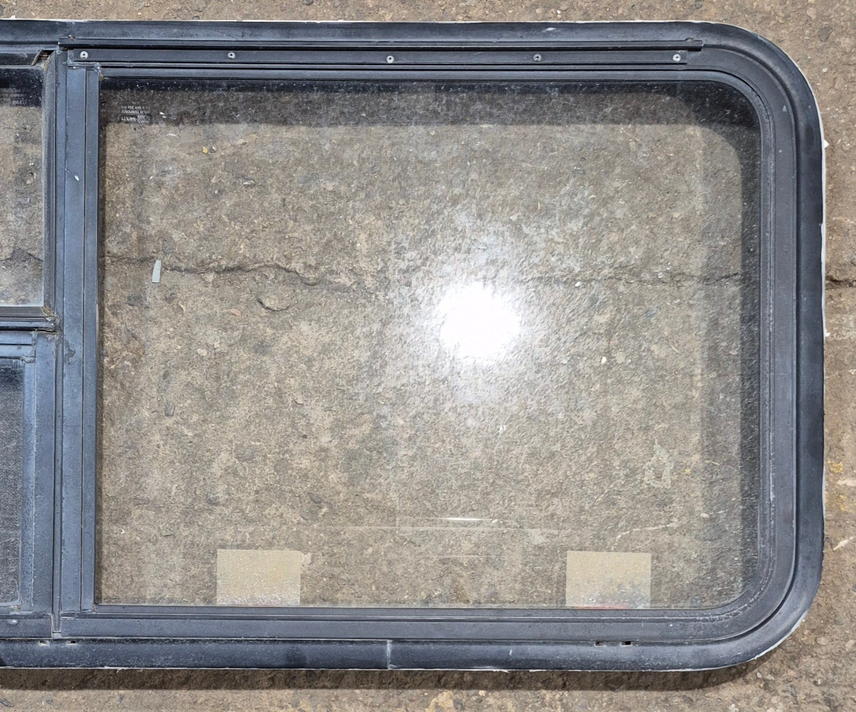 Used Black Radius Emergency Opening Window : 47 1/4" W x 21 1/4" H x 1 7/8" - Young Farts RV Parts