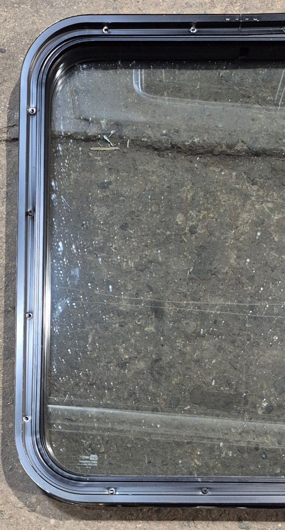 Used Black Radius Non Opening Window : 23 3/4" W x 26" H x 2" D - Young Farts RV Parts