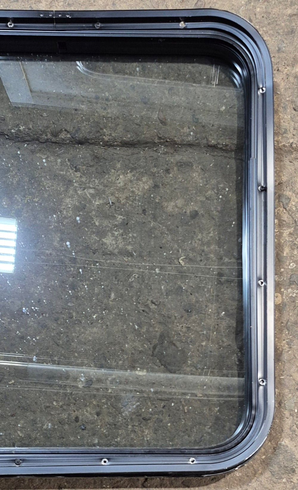 Used Black Radius Non Opening Window : 23 3/4" W x 26" H x 2" D - Young Farts RV Parts