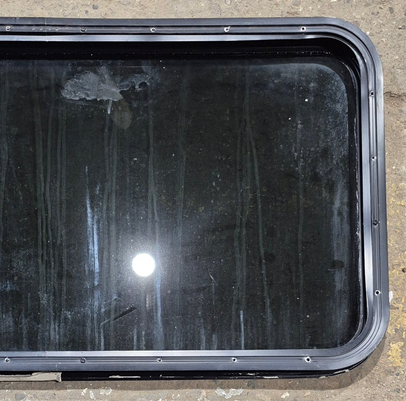 Used Black Radius Non Opening Window : 41 1/4" W x 21 1/4" H x 2" - Young Farts RV Parts