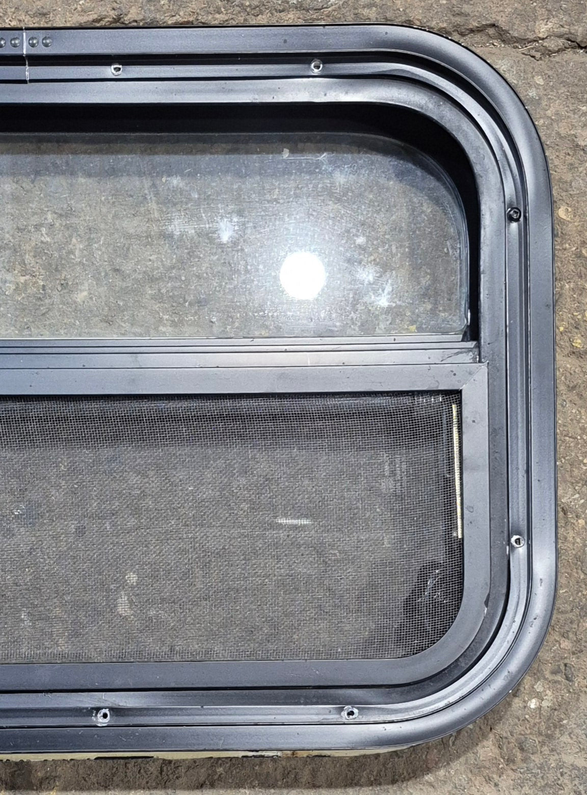 Used Black Radius Opening Window : 23 1/2" W x 14 1/4" H x 1 7/8" - Young Farts RV Parts