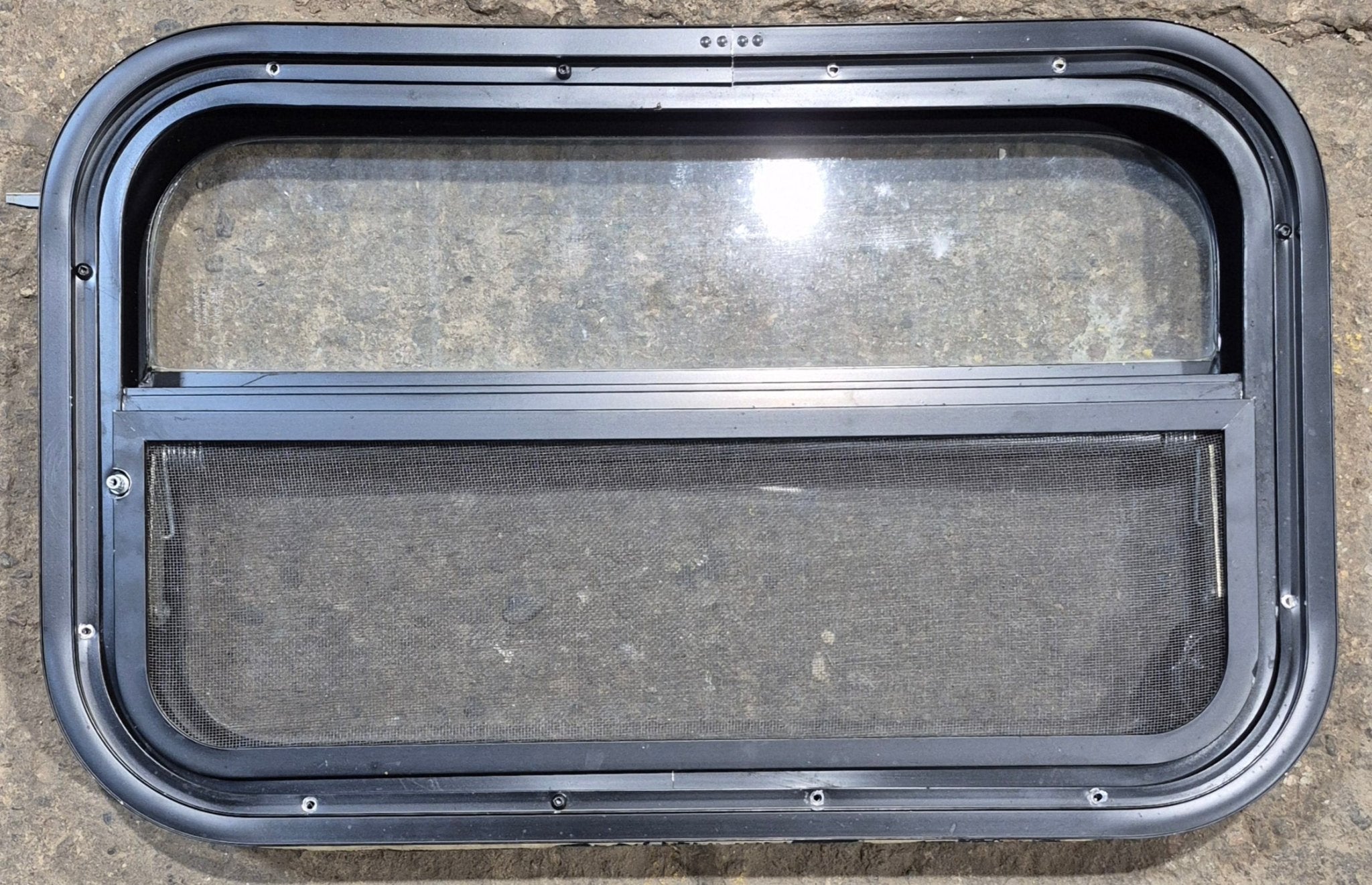 Used Black Radius Opening Window : 23 1/2" W x 14 1/4" H x 1 7/8" - Young Farts RV Parts