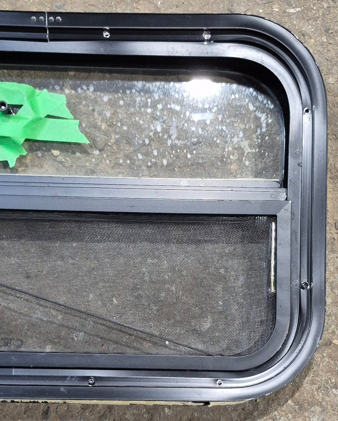 Used Black Radius Opening Window : 23 1/2" W x 14 1/4" H x 1 7/8" - Young Farts RV Parts