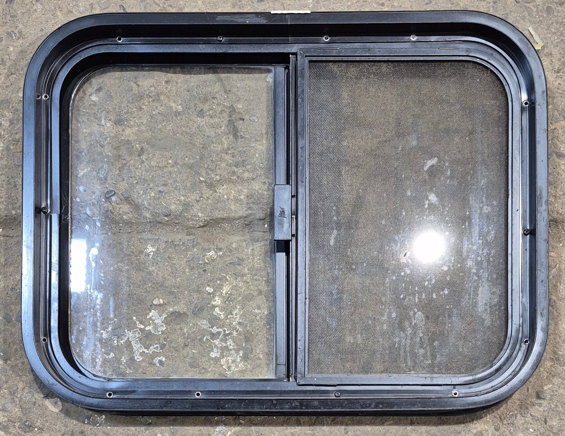 Used Black Radius Opening Window : 23 1/4" W x 17 1/4" H x 1 3/4" - Young Farts RV Parts