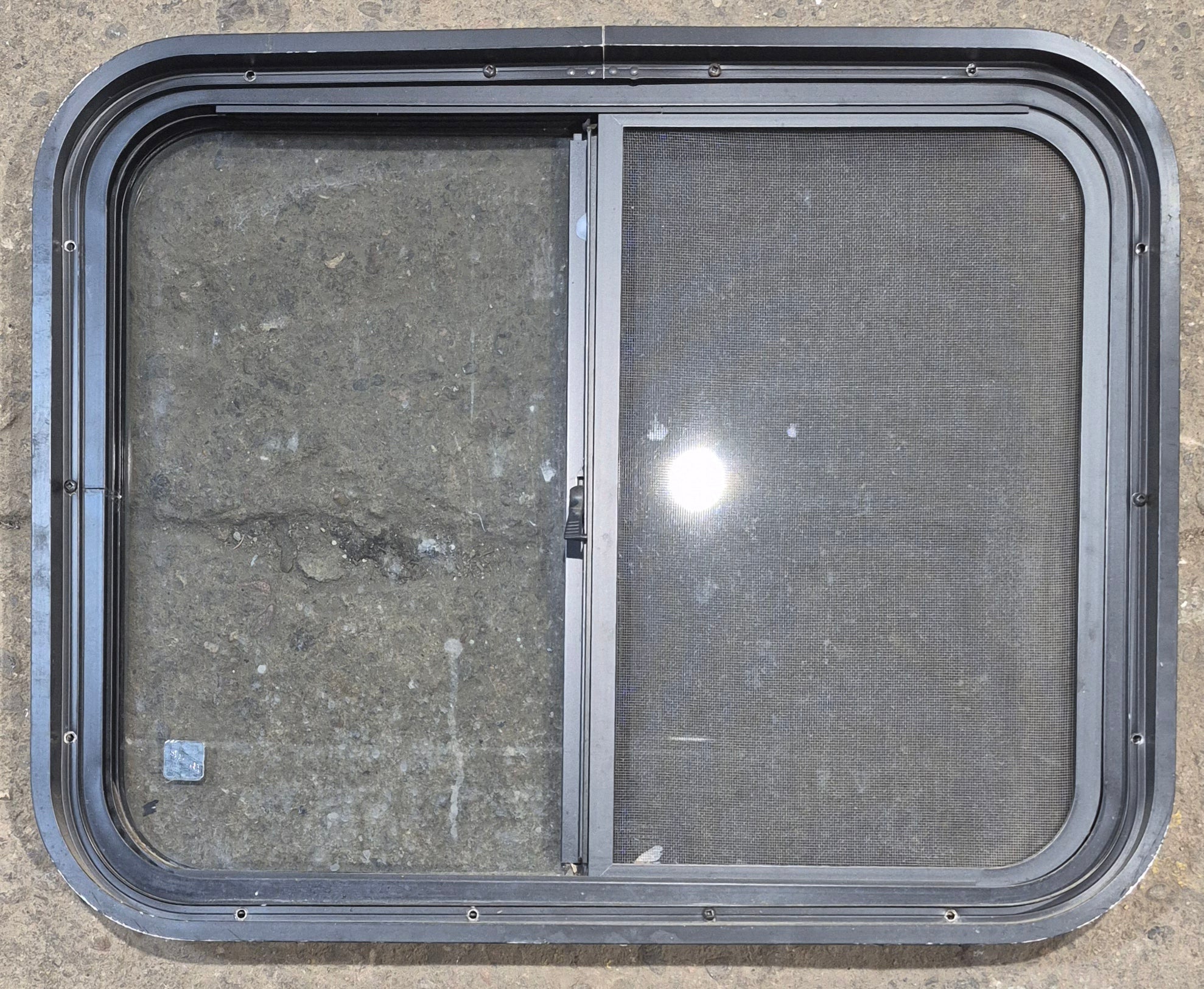 Used Black Radius Opening Window : 25 1/2" W x 20" H x 1 3/4" - Young Farts RV Parts