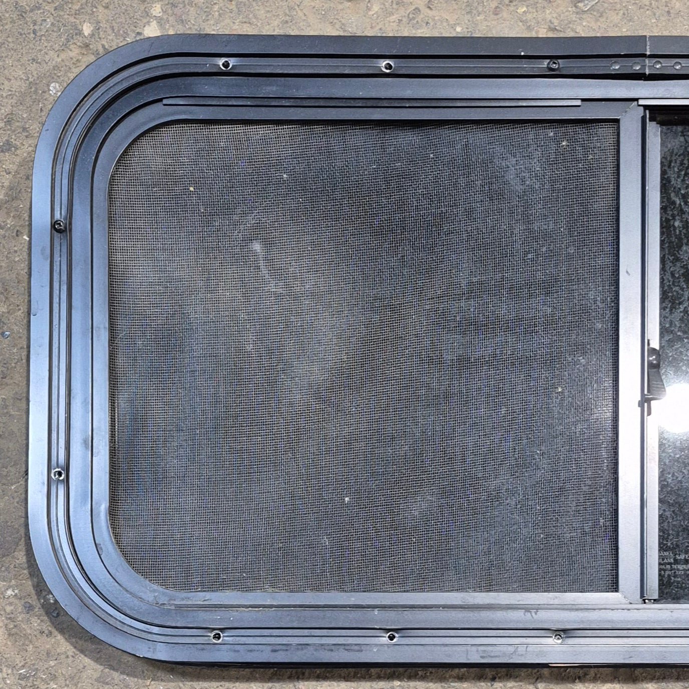 Used Black Radius Opening Window : 29 1/2" W x 14 1/4" H x 1 1/4" - Young Farts RV Parts
