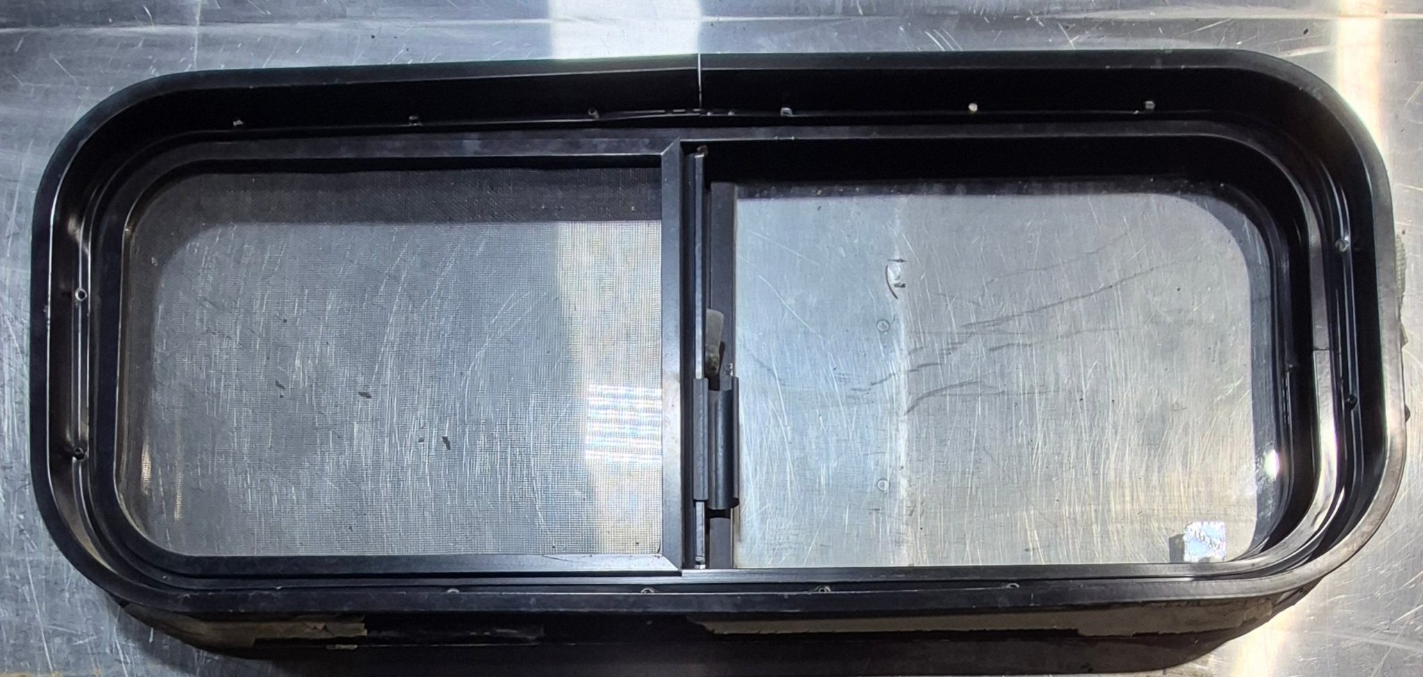 Used Black Radius Opening Window : 30 1/4" W x 11 3/4" H x 1 3/4" - Young Farts RV Parts