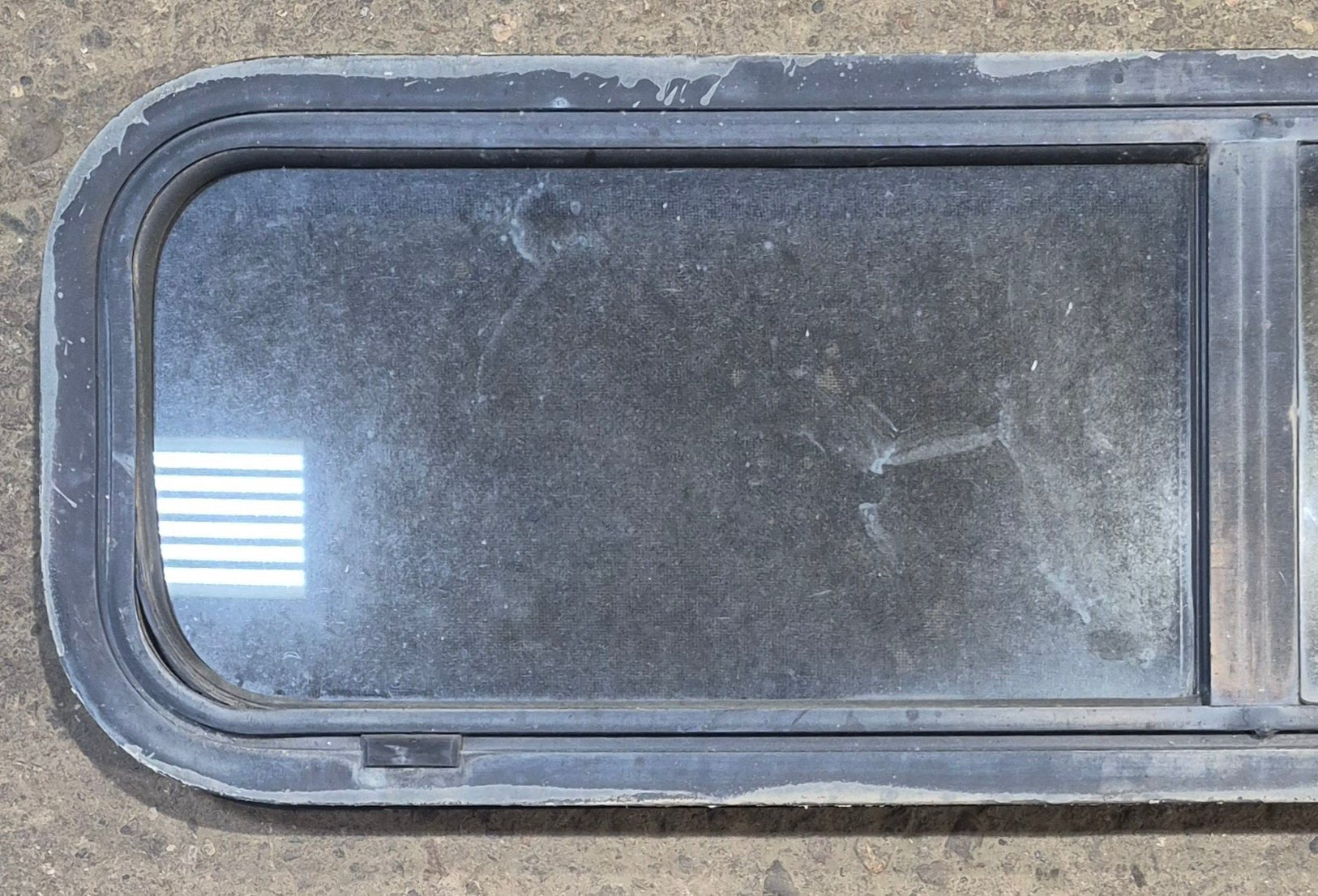 Used Black Radius Opening Window : 42 1/4" W x 11 3/4" H x 1 7/8" - Young Farts RV Parts