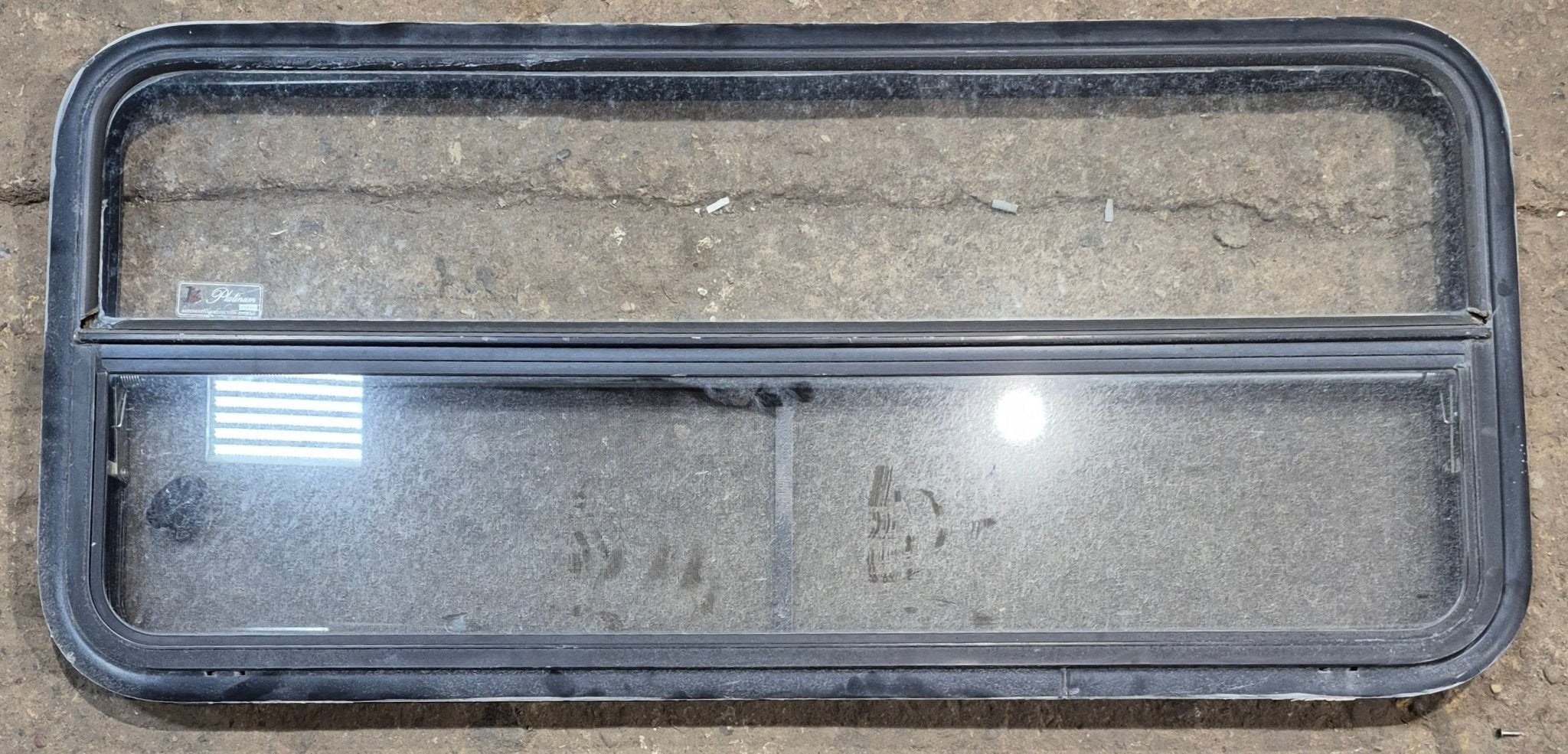 Used Black Radius Opening Window : 47 1/4" W x 21 1/4" H x 1 7/8" - Young Farts RV Parts