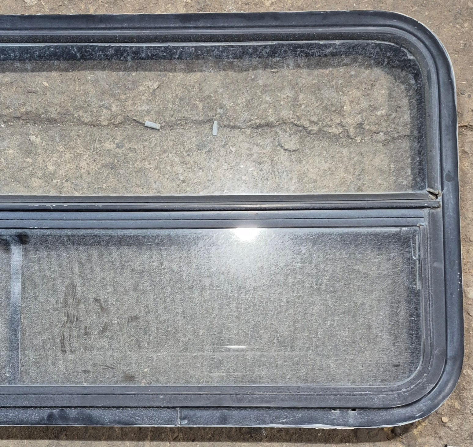 Used Black Radius Opening Window : 47 1/4" W x 21 1/4" H x 1 7/8" - Young Farts RV Parts