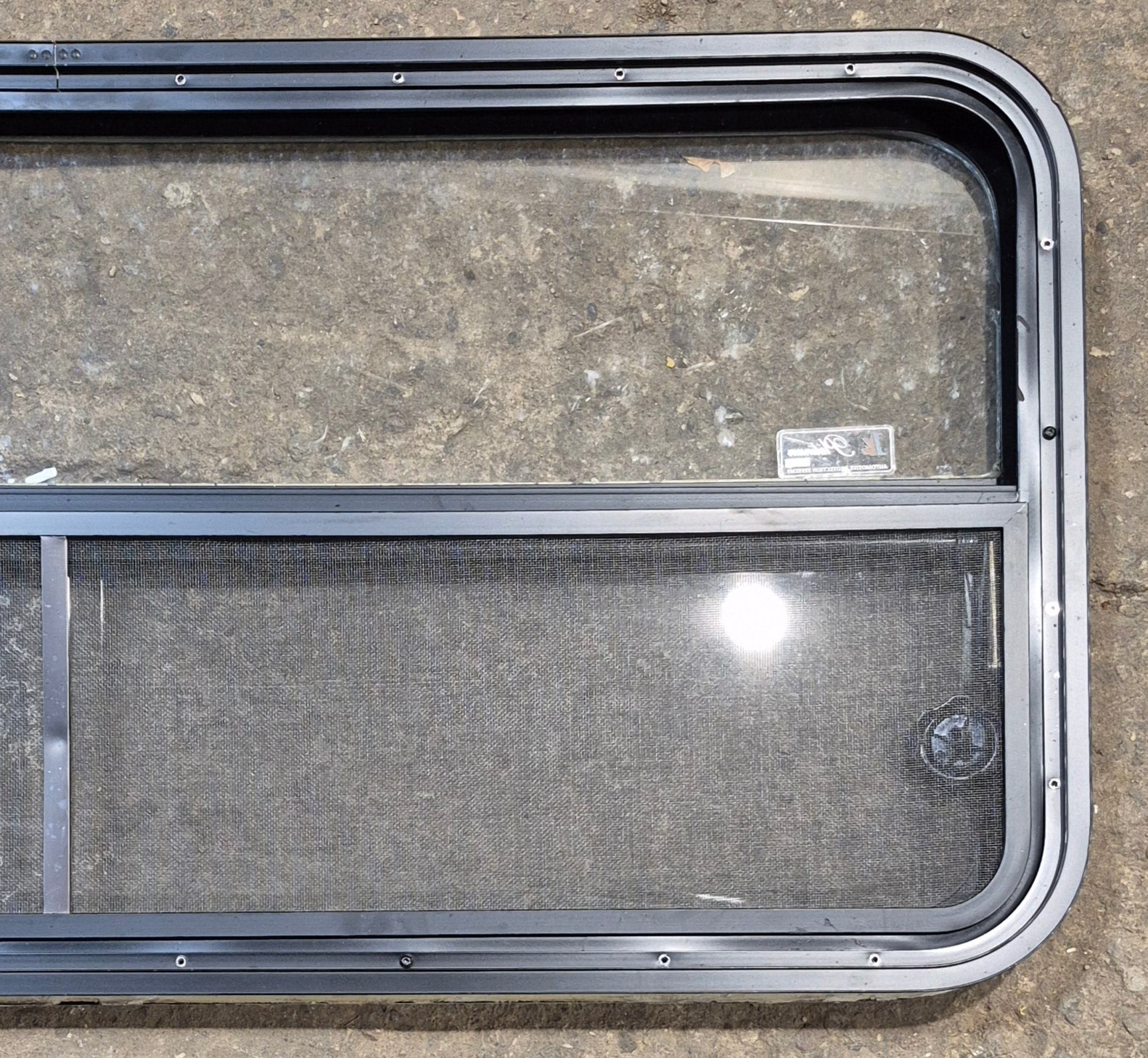 Used Black Radius Opening Window : 47 1/4" W x 21 1/4" H x 1 7/8" - Young Farts RV Parts