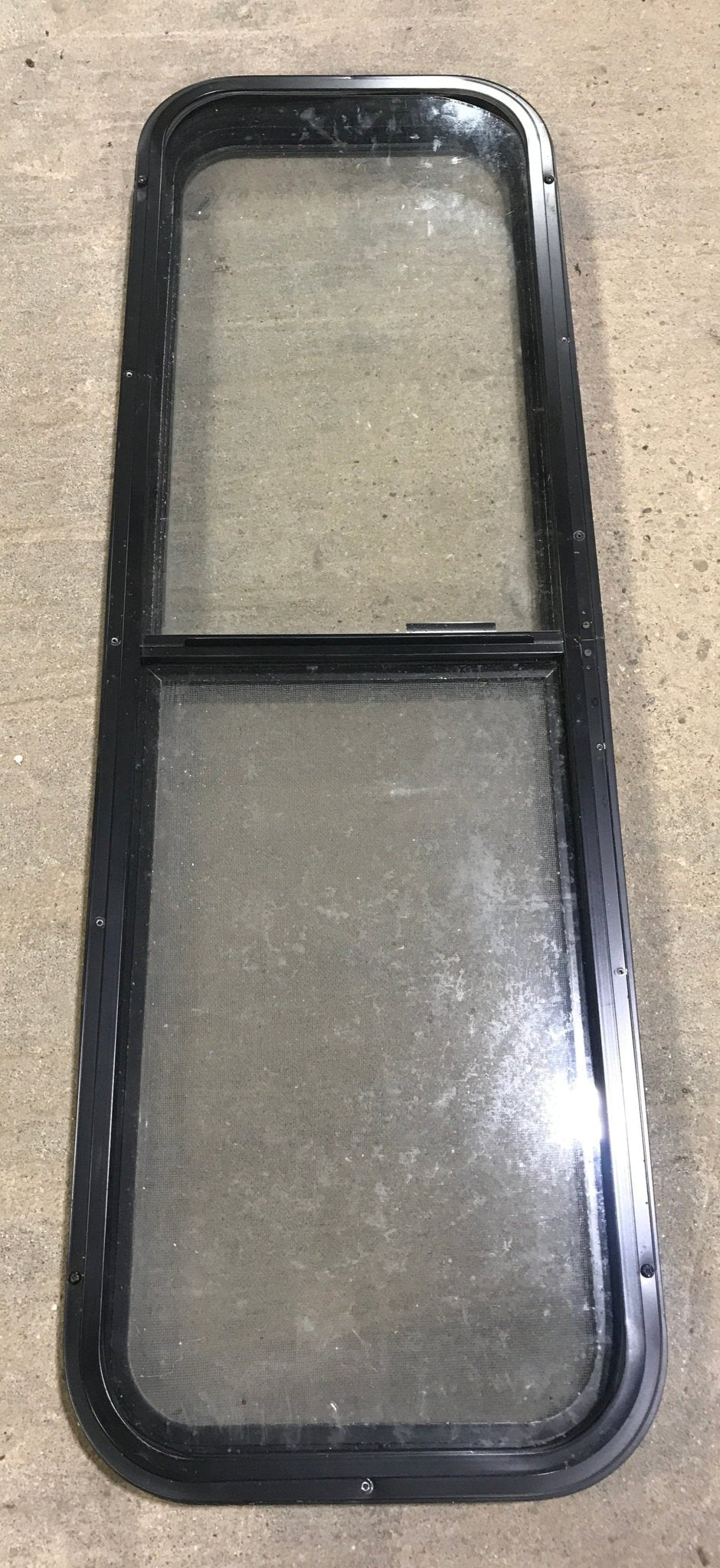 Used Black Radius Opening Window : 49" W x 15 1/4" H x 2" D - Young Farts RV Parts