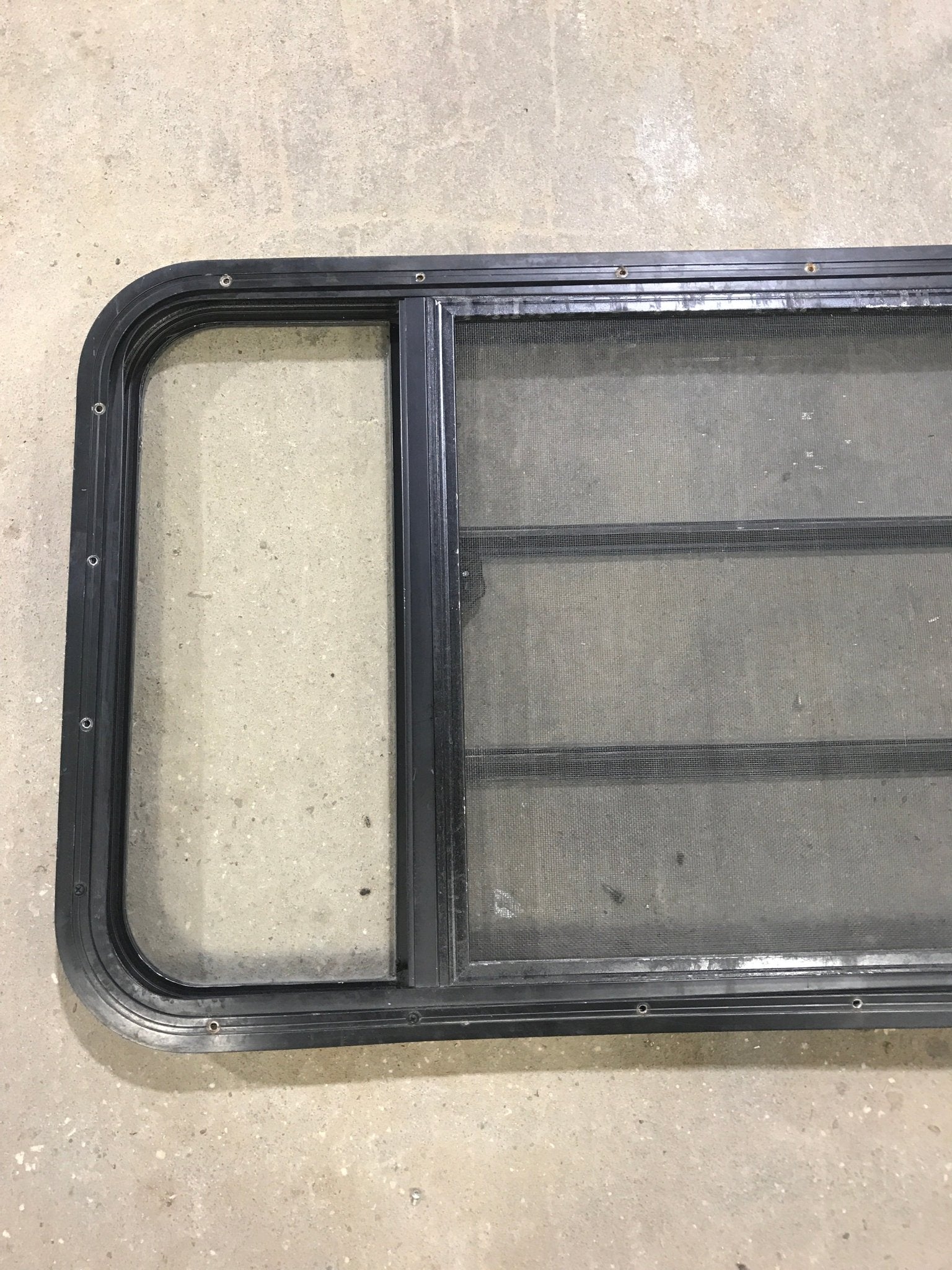 Used Black Radius Opening Window : 60" W x 21 3/4" H x 2" D - Young Farts RV Parts
