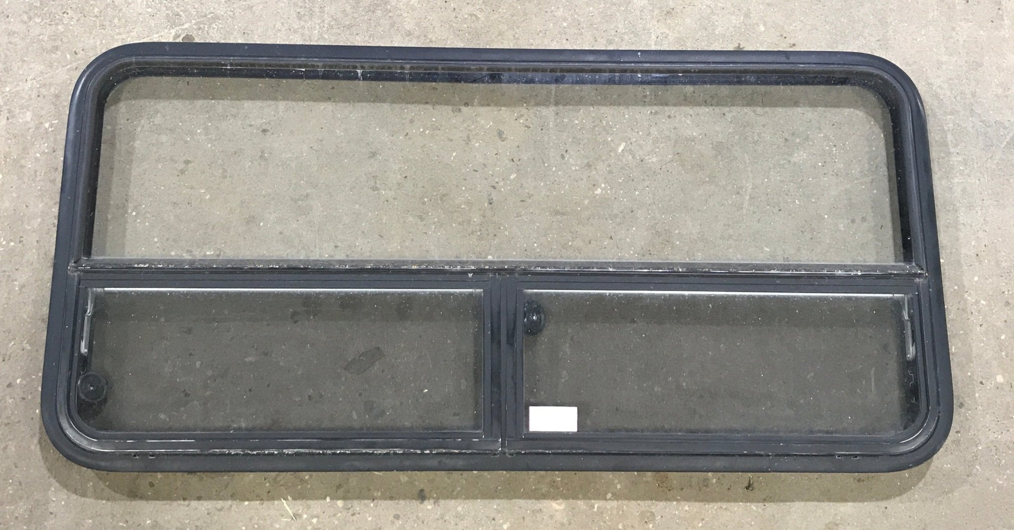 Used Black Radius Window : 53 1/4" W x 25 1/4" H x 2 1/4" D - Young Farts RV Parts