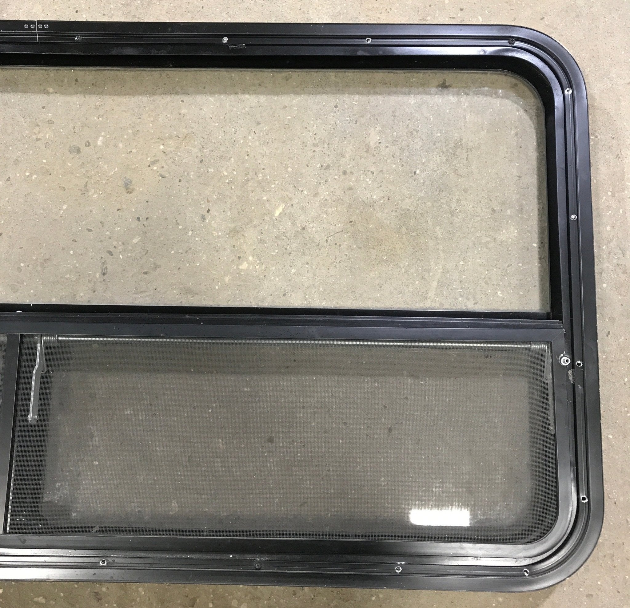 Used Black Radius Window : 53 1/4" W x 25 1/4" H x 2 1/4" D - Young Farts RV Parts