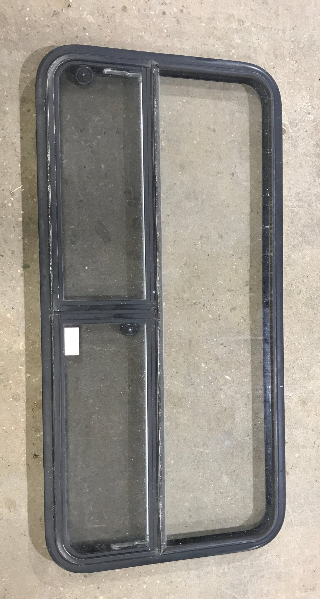 Used Black Radius Window : 53 1/4" W x 25 1/4" H x 2 1/4" D - Young Farts RV Parts