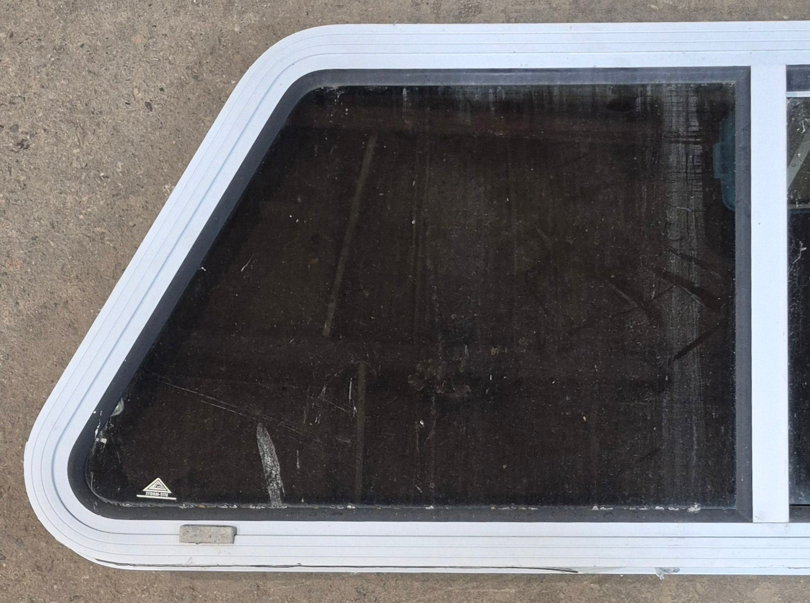 Used Slanted White Radius Opening Window : 42" W x 17 1/2" H x 1 7/8" D - Young Farts RV Parts
