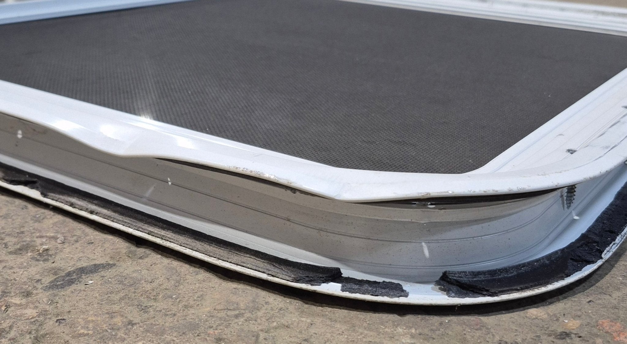 Used Slanted White Radius Opening Window : 46 3/4" W x 21 1/4" H x 1 1/4" D - Young Farts RV Parts