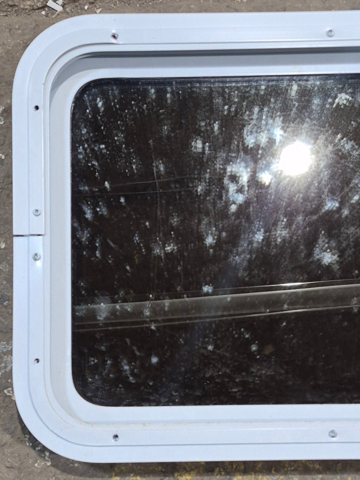 Used White Radius Non Opening Window : 24" W x 16 1/2" H x 1 7/8" D - Young Farts RV Parts