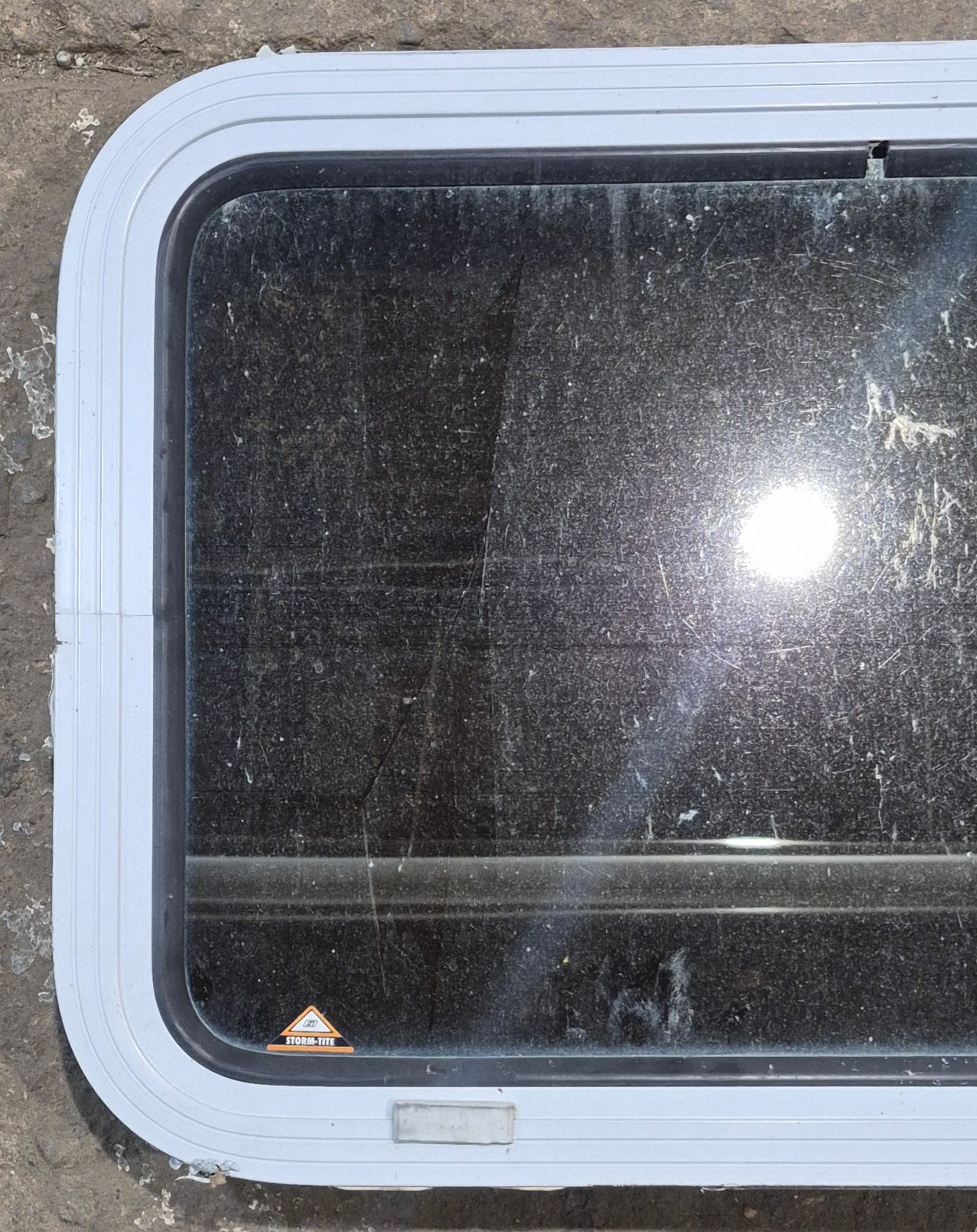 Used White Radius Non Opening Window : 24" W x 16 1/2" H x 1 7/8" D - Young Farts RV Parts