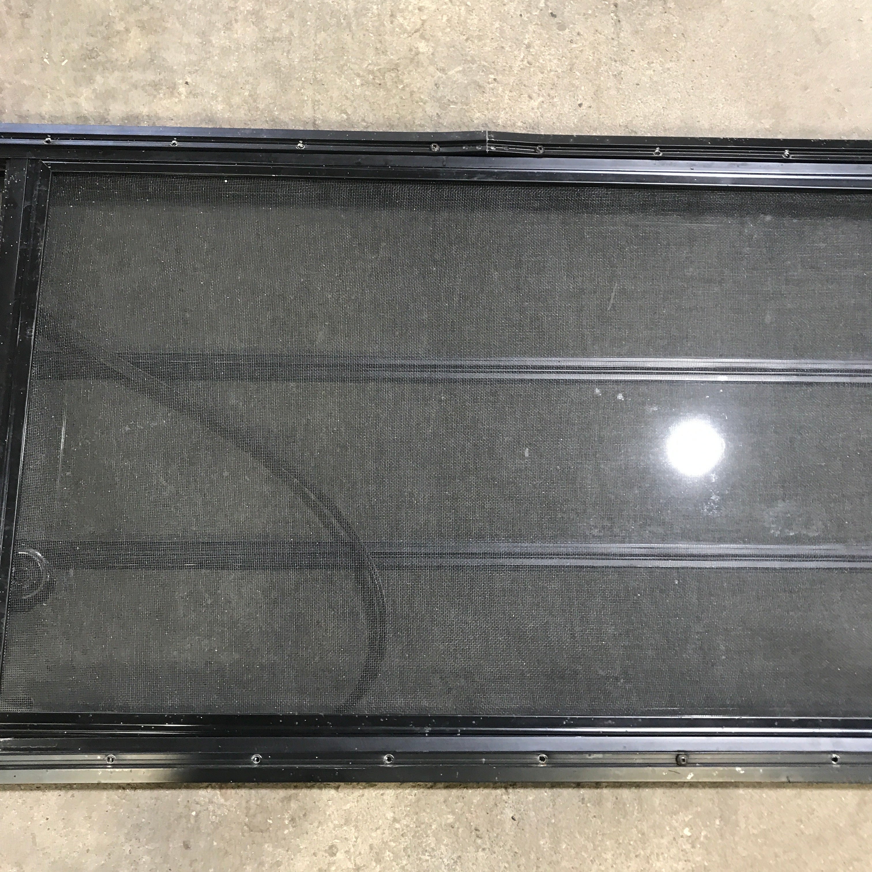 Used Black Radius Opening Window : 59.75" x 21.75" x 2" - Young Farts RV Parts