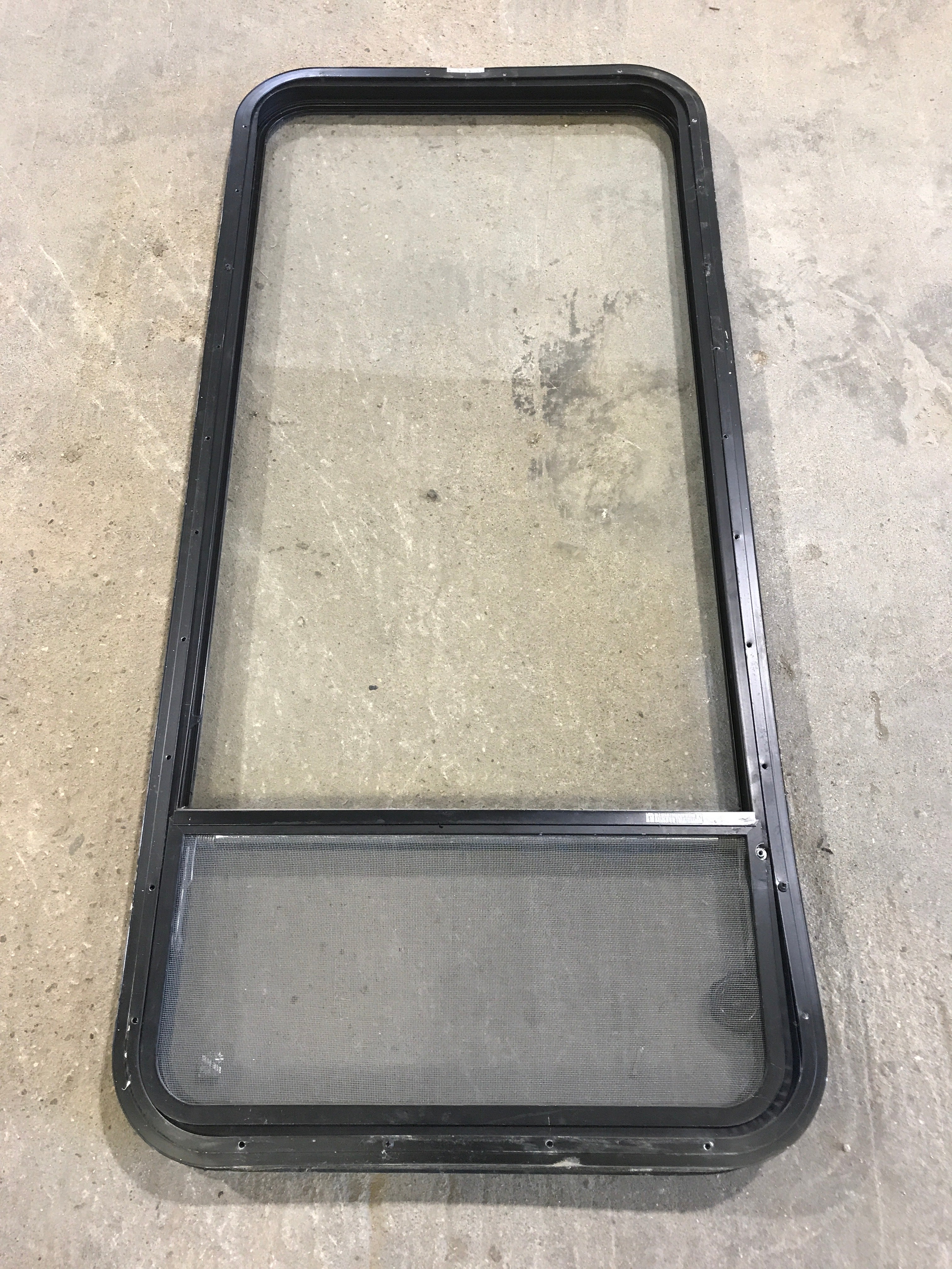 Used Black Radius Opening Window : 23 1/2" W x 52" H x 1 7/8" - Young Farts RV Parts