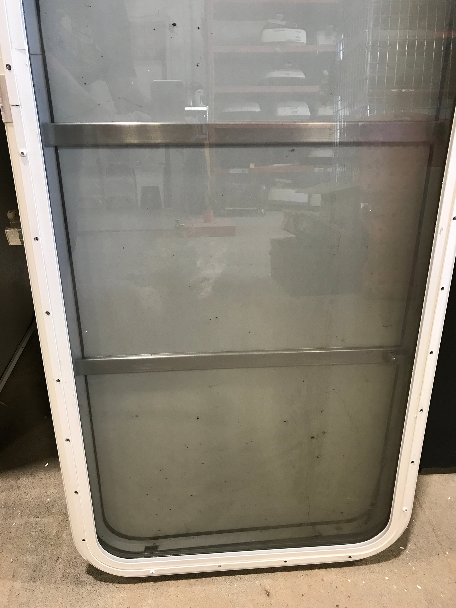 Used Radius Opening Rock Guard Covered Window: 59 1/2