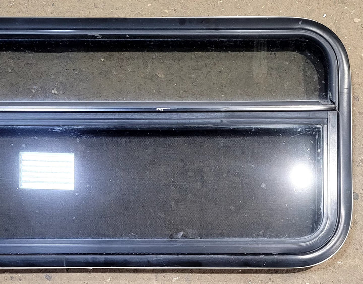 Used Black Radius Opening Window : 41 1/4" W x 17 1/4" H x 1 1/8" D - Young Farts RV Parts