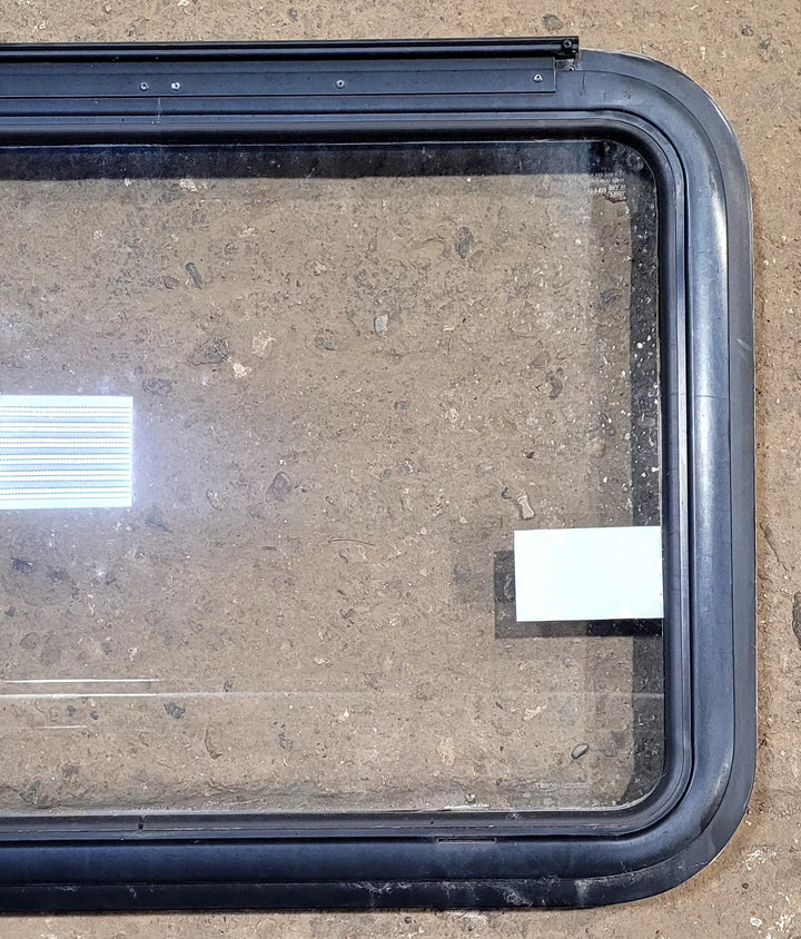 Used Black Radius Emergency Opening Window : 29 1/2" W x 21 1/2" H x 1 1/8" D - Young Farts RV Parts