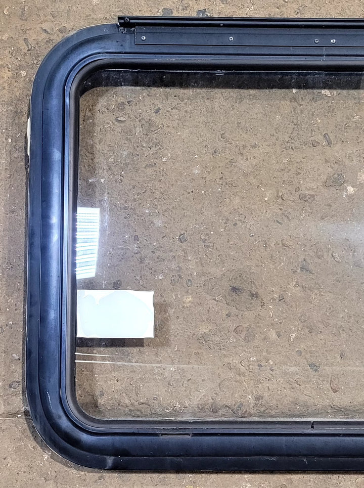 Used Black Radius Emergency Opening Window : 29 1/2" W x 21 1/2" H x 1 1/8" D - Young Farts RV Parts
