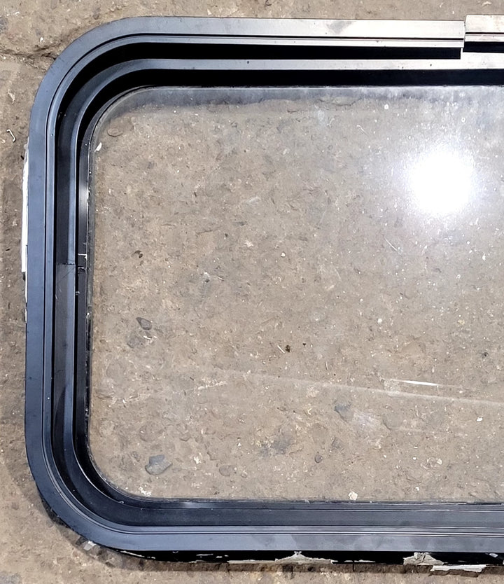 Used Black Radius Non Opening Window : 25" W x 16 3/4" H x 1 5/8" D - Young Farts RV Parts