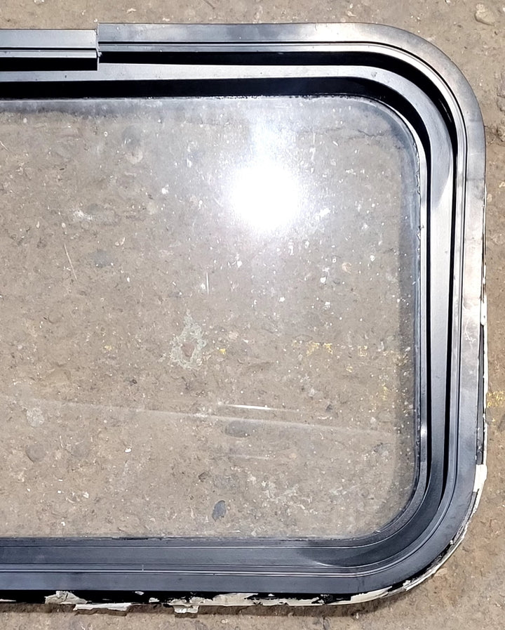 Used Black Radius Non Opening Window : 25" W x 16 3/4" H x 1 5/8" D - Young Farts RV Parts