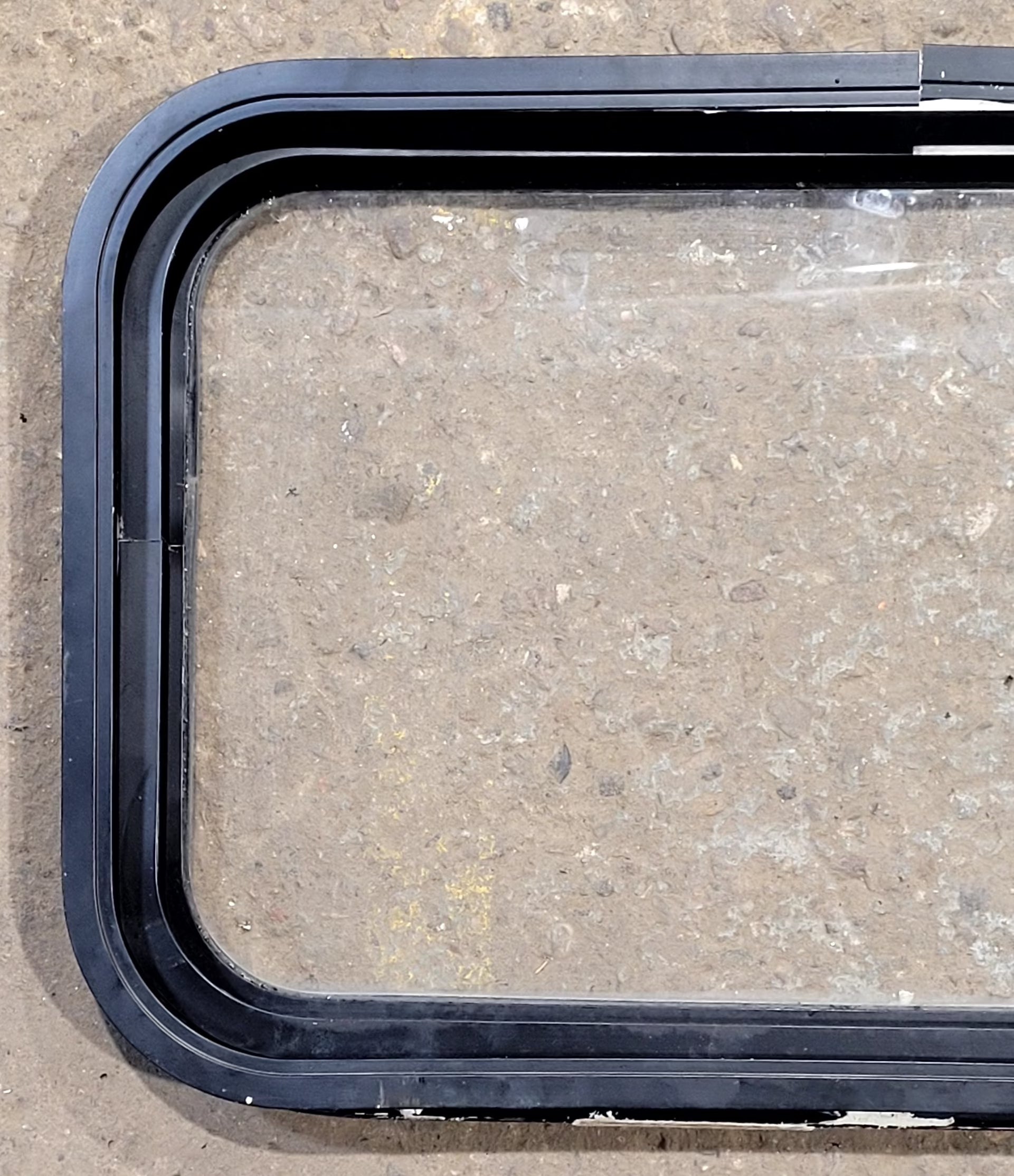 Used Black Radius Non Opening Window : 25" W x 16 3/4" H x 1 5/8" D - Young Farts RV Parts