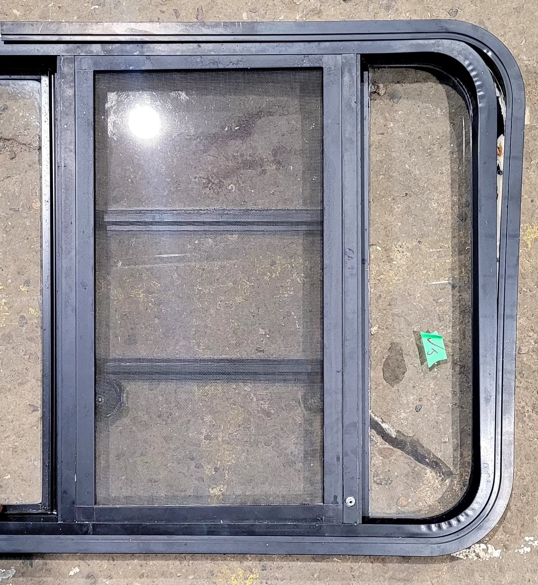 Used Black Radius Emergency Opening Window : 48 3/4" W x 23 1/2" H x 1 5/8" D - Young Farts RV Parts
