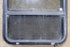 Used Black Radius Opening Window : 34 1/2" W x 23 1/2" H x 1 7/8" D - Young Farts RV Parts