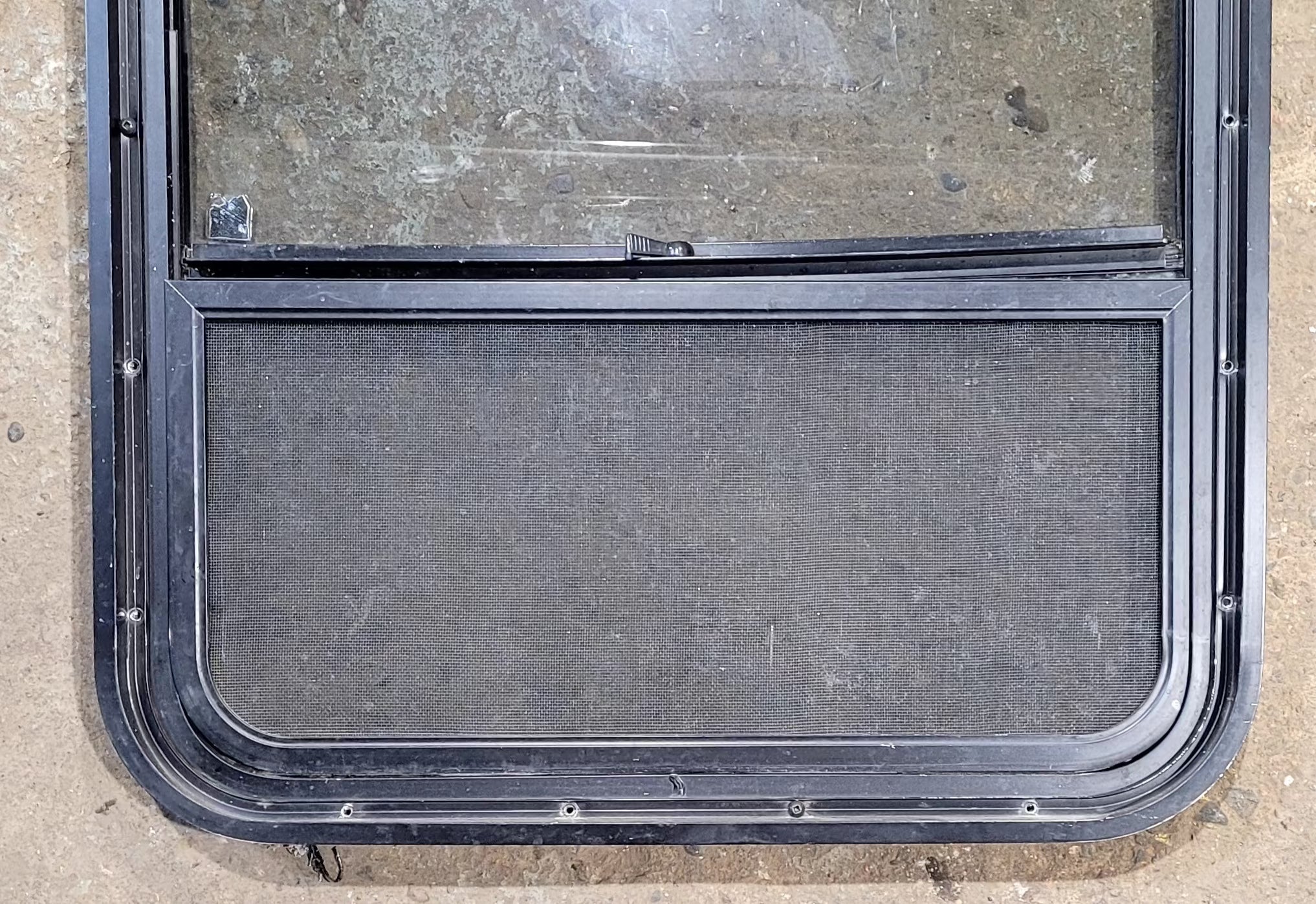 Used Black Radius Opening Window : 34 1/2" W x 23 1/2" H x 1 7/8" D - Young Farts RV Parts