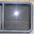 Used Black Radius Opening Window : 47 3/4" W x 23 3/4" H x 1 7/8" D - Young Farts RV Parts