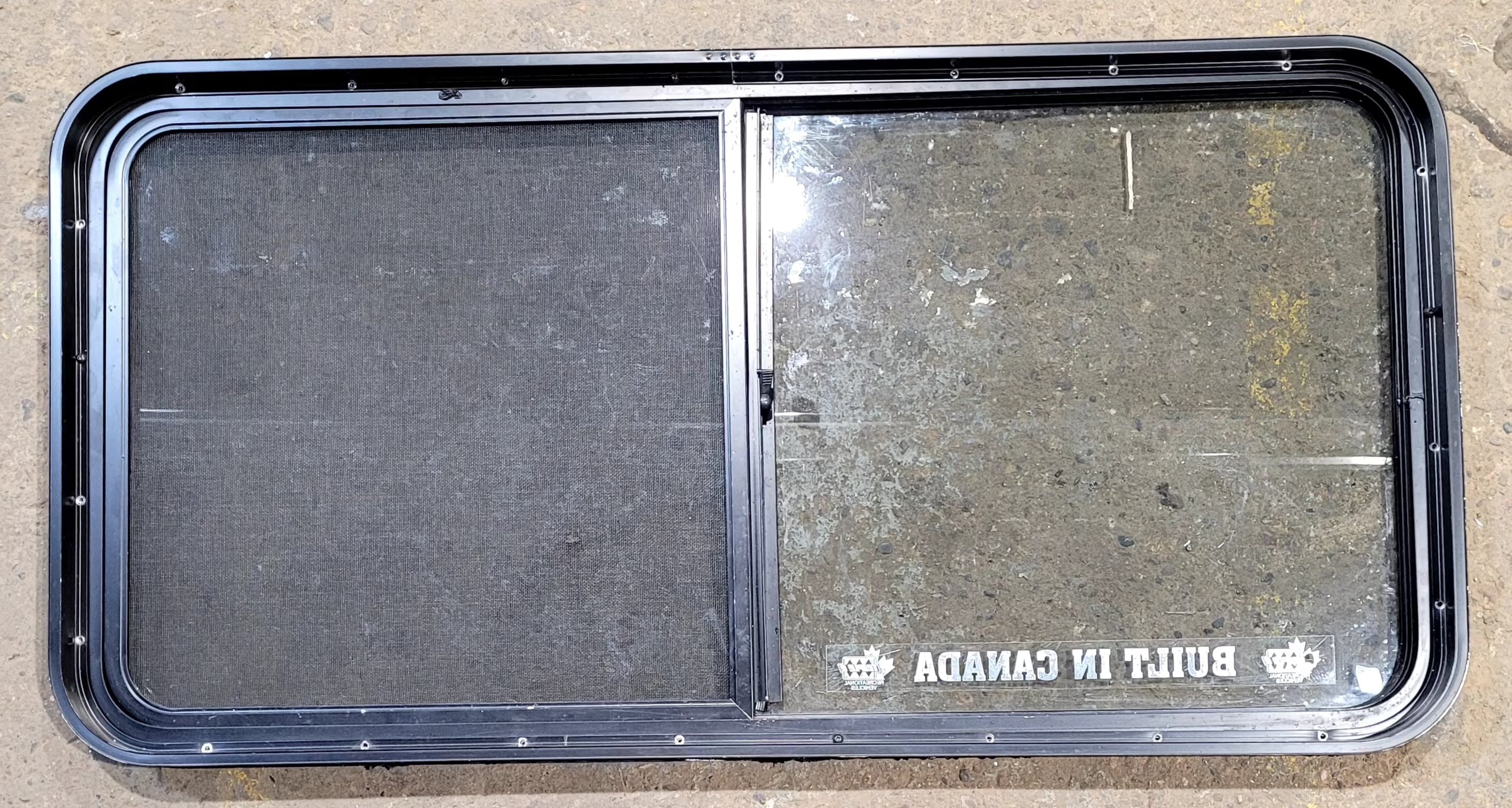 Used Black Radius Opening Window : 47 3/4" W x 23 3/4" H x 1 7/8" D