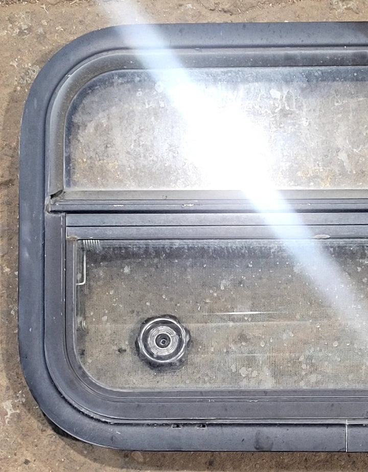 Used Black Radius Opening Window : 23 1/2" W x 14 1/2" H x 1 3/4" D - Young Farts RV Parts