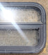 Used Black Radius Opening Window : 23 1/2" W x 14 1/2" H x 1 3/4" D - Young Farts RV Parts