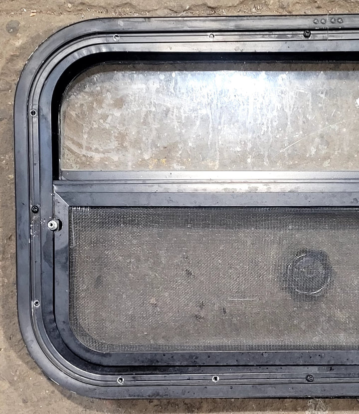 Used Black Radius Opening Window : 23 1/2" W x 14 1/2" H x 1 3/4" D - Young Farts RV Parts