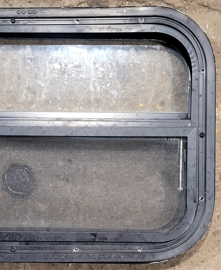 Used Black Radius Opening Window : 23 1/2" W x 14 1/2" H x 1 3/4" D - Young Farts RV Parts
