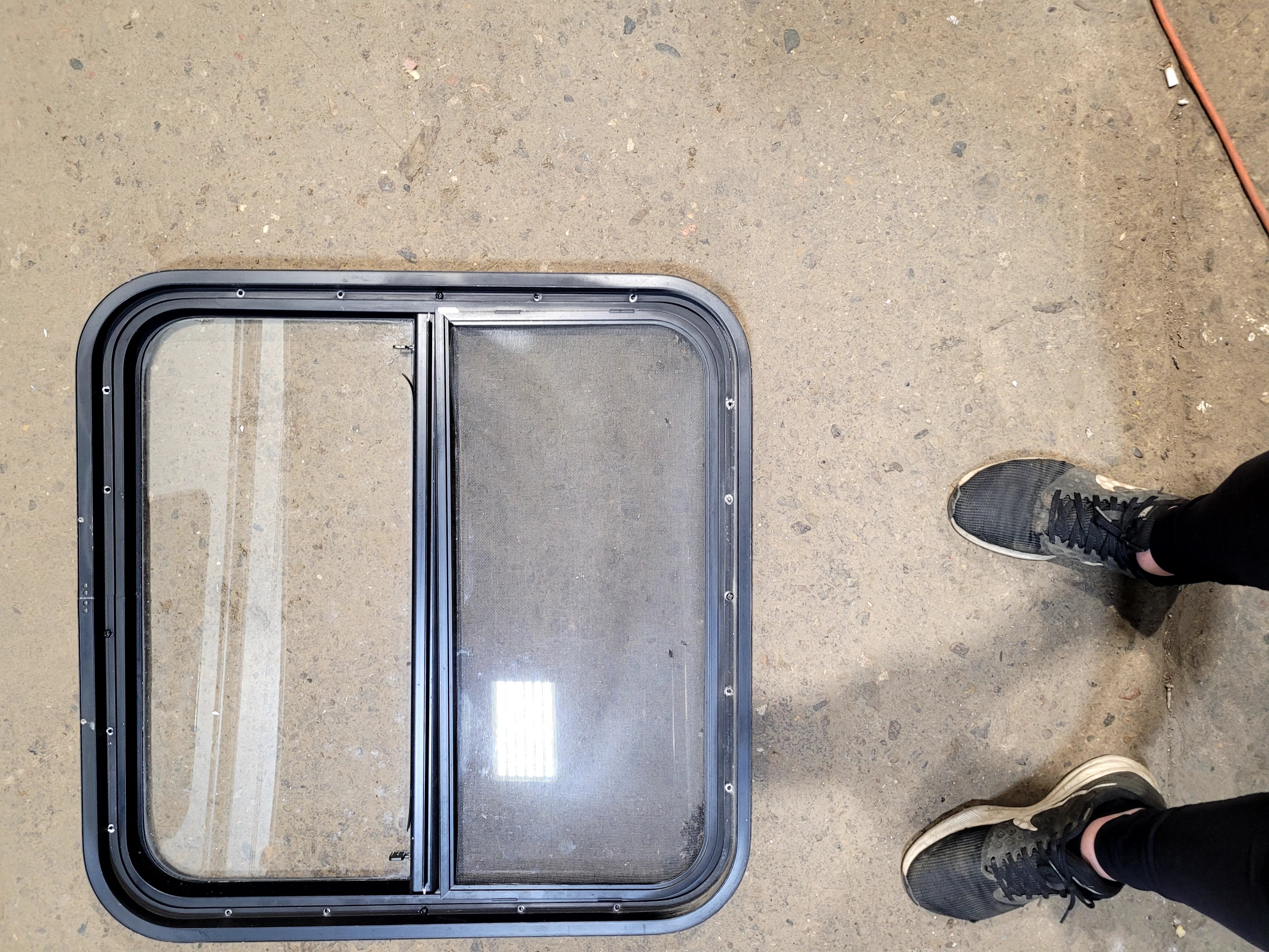 Used Black Radius Opening Window : 25 1/2" W x 25 1/2" H x 1 3/4" D - Young Farts RV Parts
