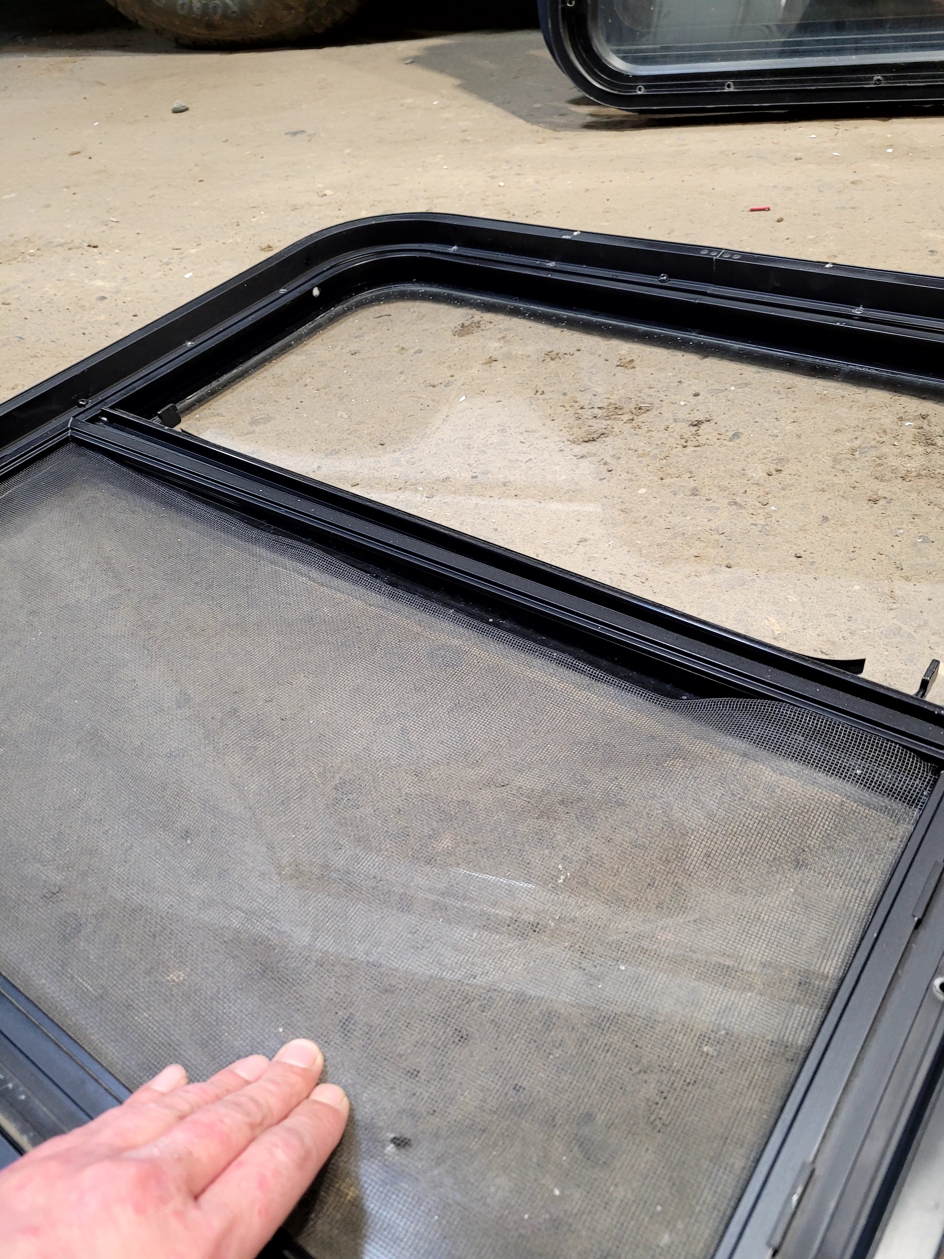 Used Black Radius Opening Window : 25 1/2" W x 25 1/2" H x 1 3/4" D - Young Farts RV Parts