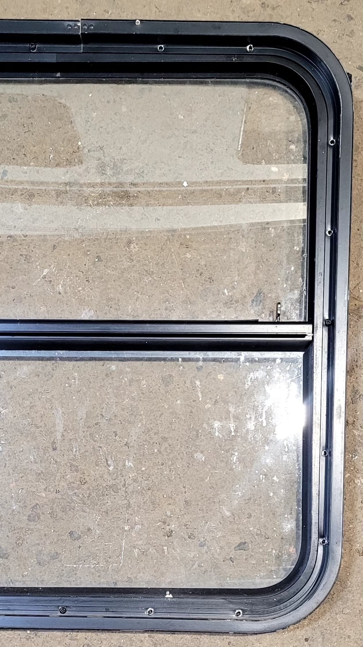 Used Black Radius Opening Window : 25 1/2" W x 25 1/2" H x 1 3/4" D - Young Farts RV Parts